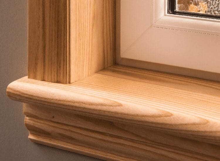 Close up photo of a natural ash solid timber sill and surround