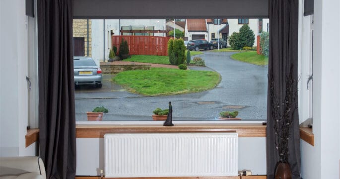 Casement window complete with oak finish externalling and white sill and surrounds internally.