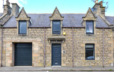 Exterior image of home with anthracite grey windows and door