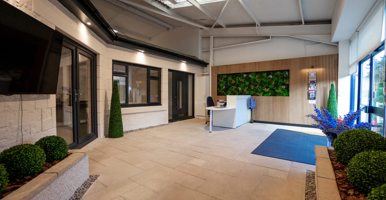 Reception area of the CR Smith showroom in Dunfermline, Fife. Showcasing a uPVC french door, uPVC double-glazed windows and a TimberLuxe composite door.