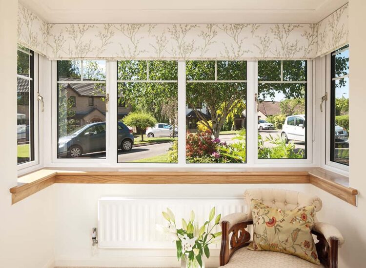 Internal image of a Lorimer casement window in white finish, with Georgian bars. Complete with a royal oak timber sill.